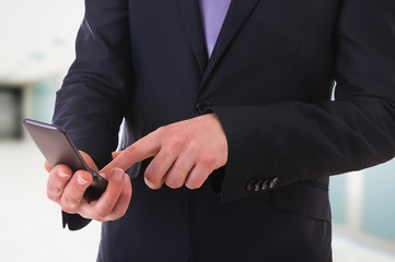 Businessman using cellphone.