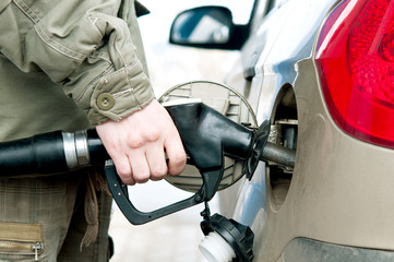 Man pumping fuel  in to the tank