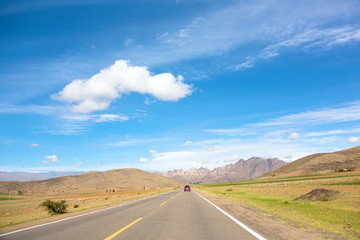 Fototapeta premium Acceleration lane leading straight to a mountains range