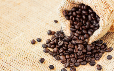 Angle view of roasted coffee beans in jute bag
