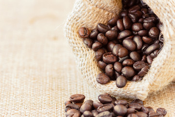 Low angle view of roasted coffee beans in jute bag