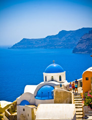 Fototapeta na wymiar Church Cupolas of Oia town on Santorini island, Greece