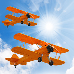 Old biplanes on the sky.