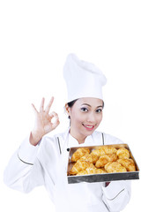 Beautiful chef and croissant on white
