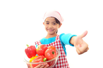Fototapeta na wymiar 野菜を持つ笑顔の女の子