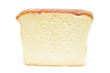 Sliced butter cake on white background