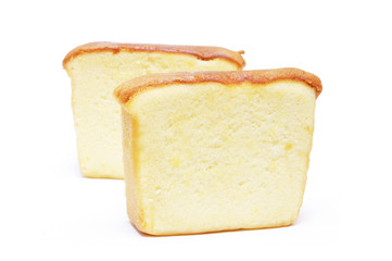 Sliced butter cake on white background