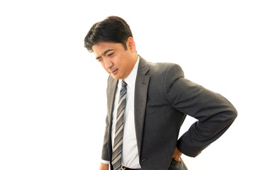 腰痛を訴えるビジネスマン