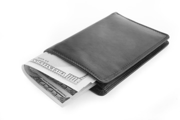 US dollars in a black wallet isolated on white