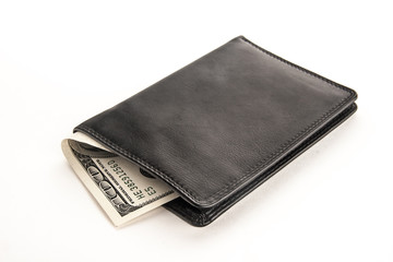 US dollars in a black wallet isolated on white