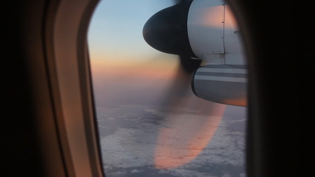 Morning flight with detail of turboprop engine.