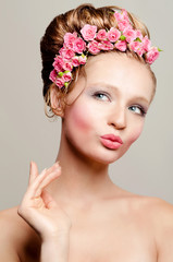 Portrait of young bride with flowers of roses