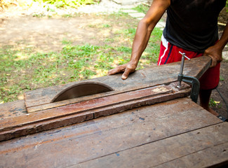 Man working on a saw