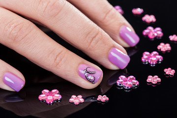 Fototapeta premium Close-up Of Fingernails And Rhinestones