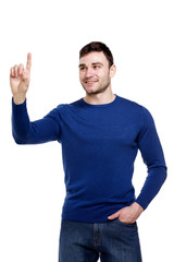 Smiling man pointing, isolated on a white background