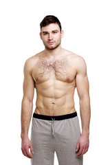 Fototapeta premium Topless man stood on a white background