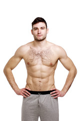 Fototapeta premium Topless man stood isolated on a white background