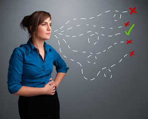 Young woman choosing between right and wrong signs