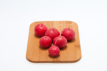 Garden radish on wooden board