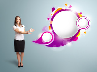 Attractive woman presenting abstract speech bubble copy space