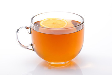 Glass cup of black tea with lemon