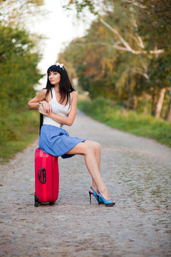 Young woman hitchhiking