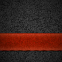 Red leather stripe on black leather background with copyspace -
