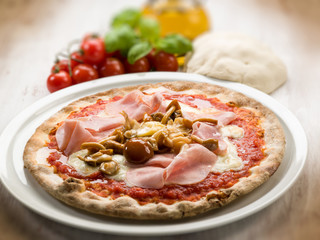 pizza with ham and mushroom, selective focus
