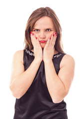 Portrait of a sulky young woman holding her face in hands - obrazy, fototapety, plakaty