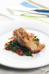 tilapia fillet with warm spinach and bacon salad