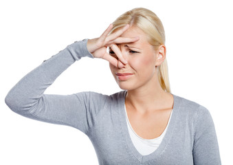 Woman covers nose with hand showing that something stinks