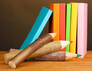 Colorful wooden pencils with books