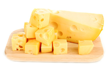 Cut cheese on wooden board isolated on white