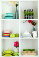 Beautiful white shelves with tableware and decor.