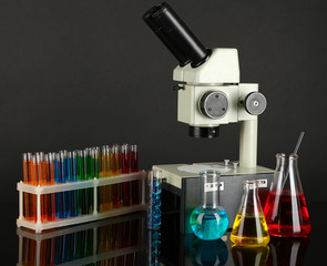 Test tubes with colorful liquids and microscope