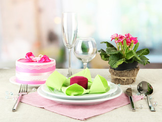Romantic table serving on bright background