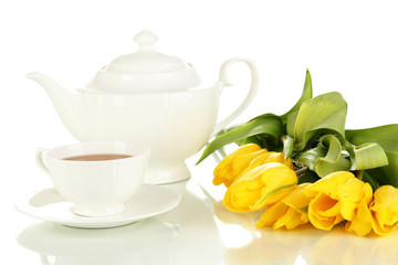 Tea set and tulips isolated on white