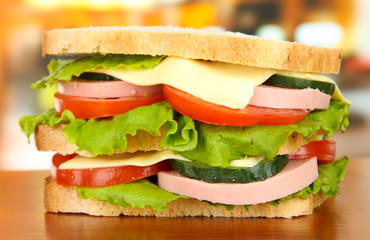Tasty sandwich on table in cafe