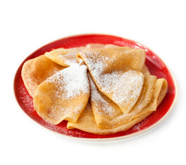 Pancakes on red plate