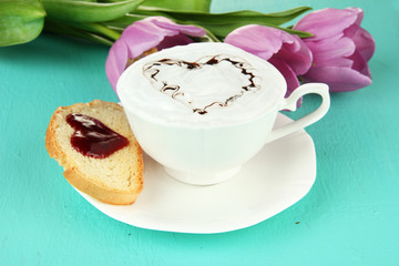 Composition of coffee, toast and tulips on color background
