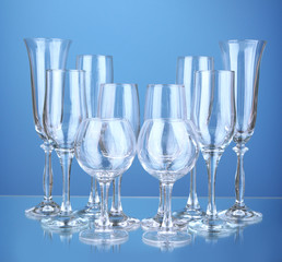 Collection of wine glasses, on blue background
