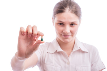 Woman holds pills