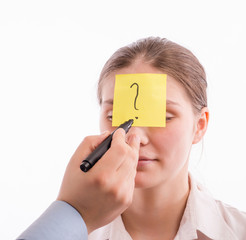 piece of paper on her forehead
