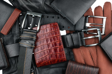 Men's wallet lying on the belts and gloves