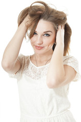 Fototapeta premium Portrait of smiling young girl on white background.
