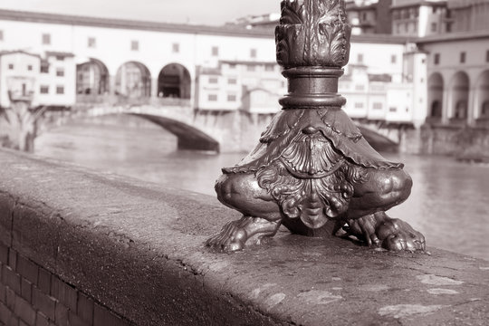 Foot of Lamppost with Ponte Vecchio Bridge, Florence, Italy