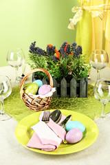 Easter table setting on color background