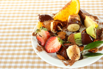 Fruit in chocolate on a colored background