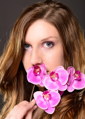attractive woman with a orchid and beautiful makeup