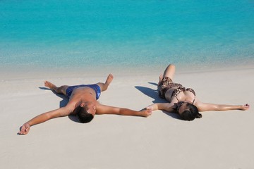 happy young  couple enjoying summer on beach